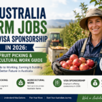 Australia farm jobs: farm worker harvesting apples in an Australian orchard, showcasing visa-sponsored fruit picking and agricultural work opportunities in 2026.