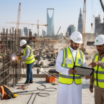 Construction & Skilled Trades Jobs in Saudi Arabia: High-Demand Careers Supporting Vision 2030 Projects featuring Construction & Skilled Trades professionals working on large-scale infrastructure projects, cranes, and modern city development sites across Saudi construction zones.